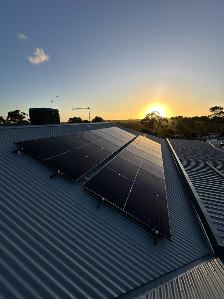 Residential solar array installed by Charge On Electrical, at sunset