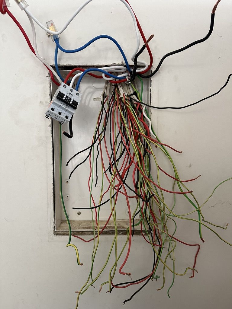 Switchboard stripped out with circuits ready to be reconnected